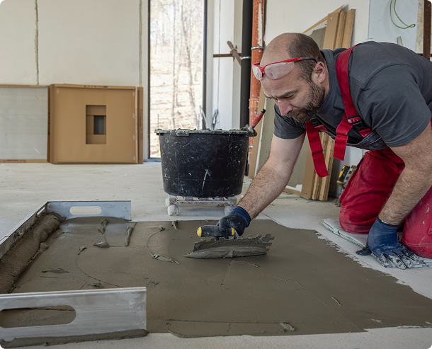 Professional tiler preparing to install floor tiles